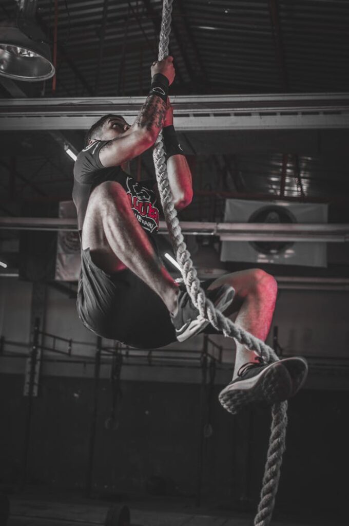 pexels-photo-2468339 Man Climbing on Rope